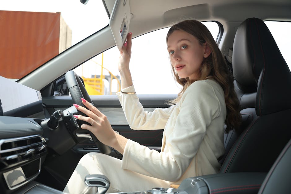 Stylish woman in an elegant car adjusting sun visor, emphasizing premium lifestyle and modern car interior.
