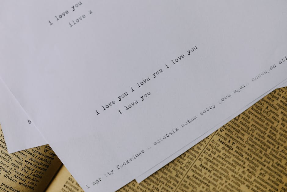Typewritten note with 'I love you' on vintage paper background, evoking nostalgia.
