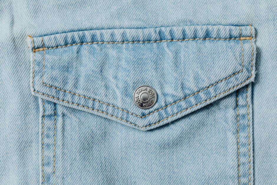 A detailed view of a stylish denim pocket showcasing stitch work and texture.