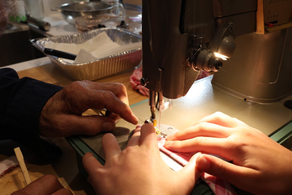 Hands of different ages working together on a vintage sewing machine, highlighting craftsmanship.