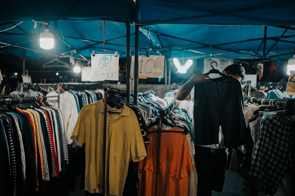 Explore a vibrant night market in Iligan City, Philippines, showcasing clothes and lively ambiance.